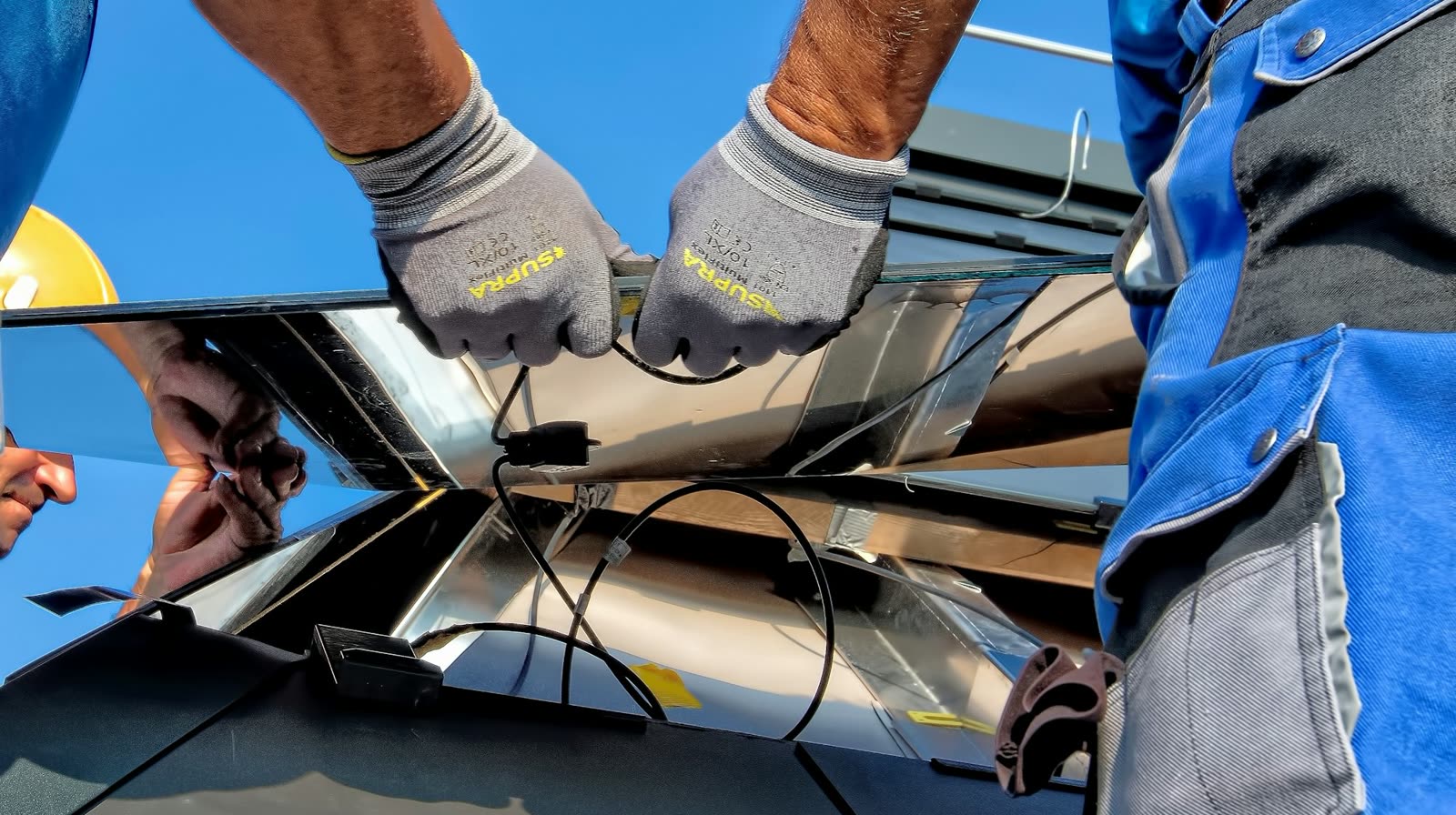 Technicians installing solar panels